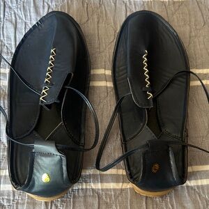 Navy leather slip on , lace tie casual shoe. New, never worn.